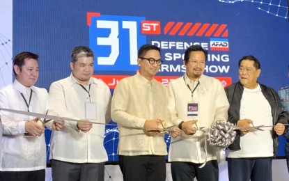 <p><strong>SPORTING ARMS SHOW.</strong> National Police Commission (Napolcom) Vice Chairperson and Executive Officer Rafael Vicente Calinisan (center) and Association of Firearms and Ammunition Dealers (AFAD) President Edwin Lim led the ribbon-cutting ceremony during the opening of the 31st Defense and Arms Show on Wednesday (July 23, 2025) at the SMX Convention Center in Pasay City. The event will run until July 27. <em>(PNA photo by Jean Malanum)</em></p>
